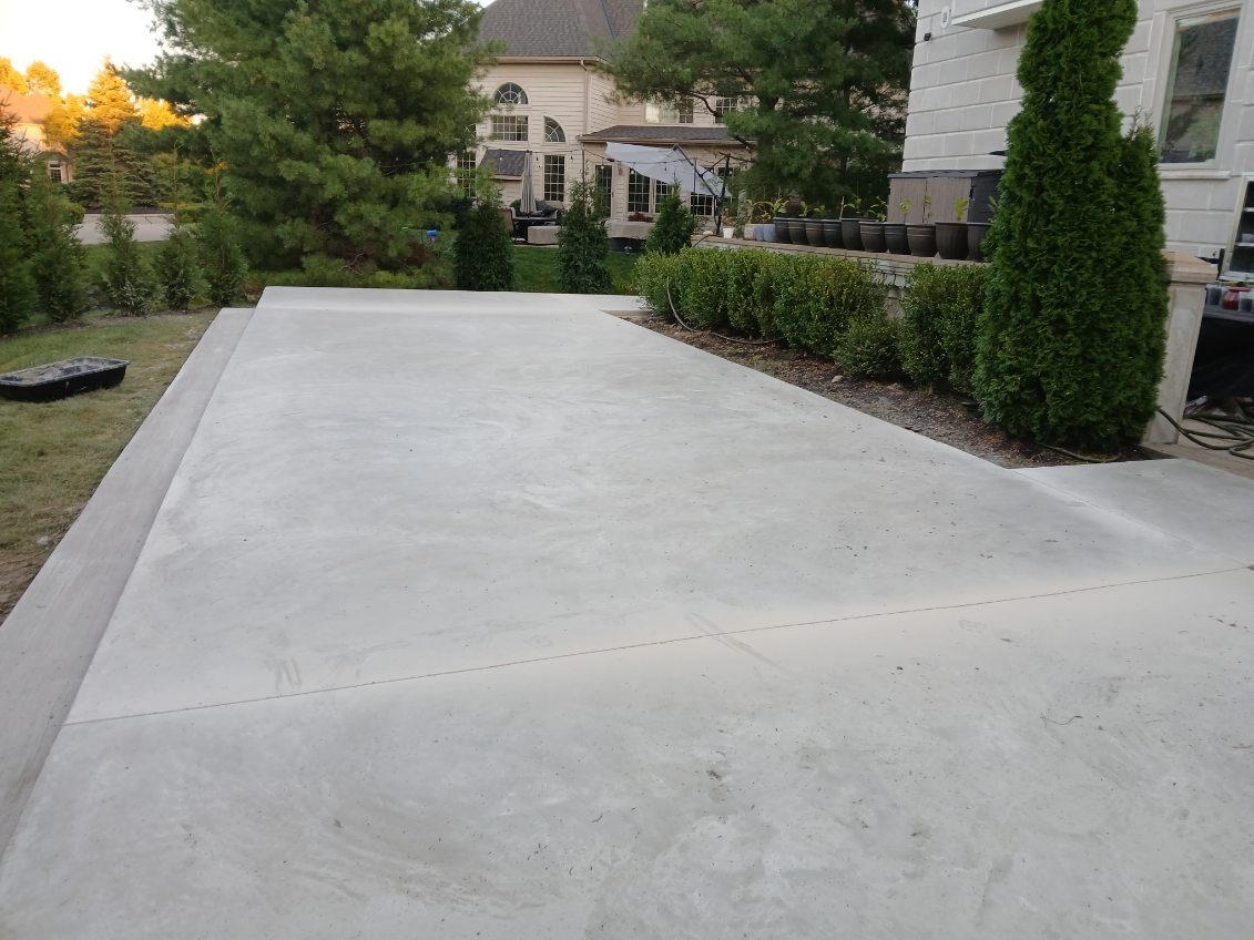 Freshly poured concrete driveway at a residential home
